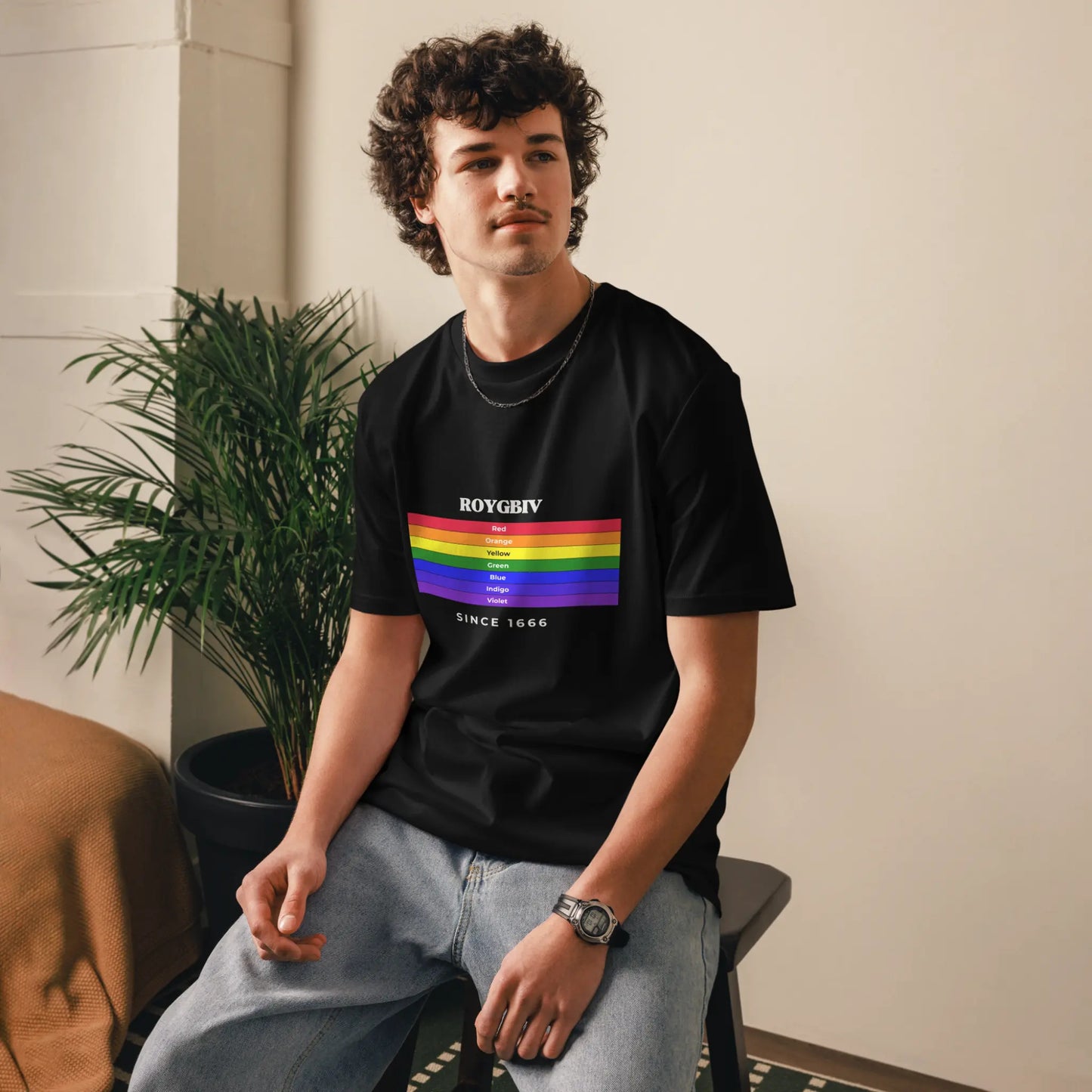 Black unisex ROYGBIV organic cotton T-shirt from Solar Spectrum Press worn by a male model.