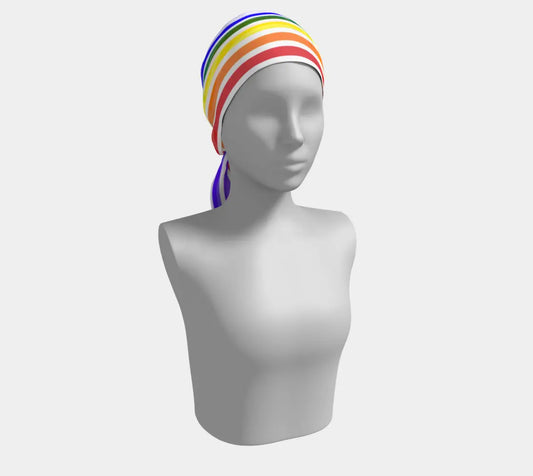 Long silk scarf featuring vibrant ROYGBIV rainbow stripes, styled with elegant draping, by Solar Spectrum Press.